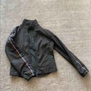 Dark green jacket with rainbow piping on sleeves